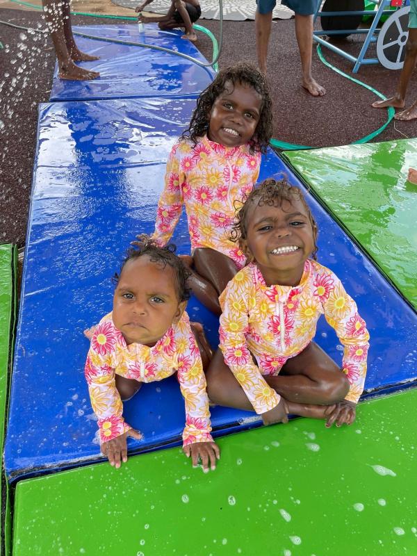Three young girls in new pink bathers