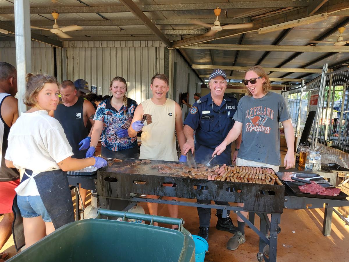 Jilkminggan and Mataranka residents cooking a BBQ