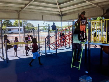 Young children playing on new playground