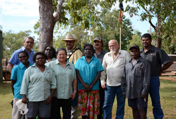 Mayor and Councillors all standing together under a tree smiling at camera