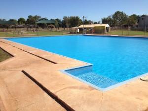 Image of clear blue pool in a community in the region