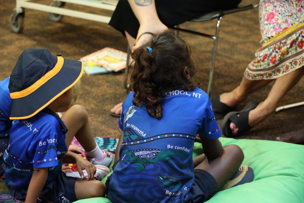 2 students sitting on bean bags 