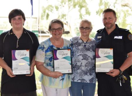 Four award recipients with Citizen of the Year certificates