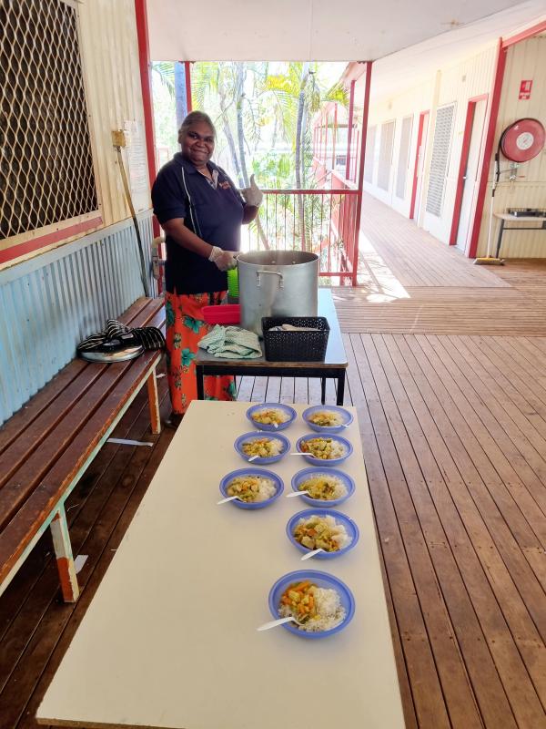 Council staff members preparing food for kids