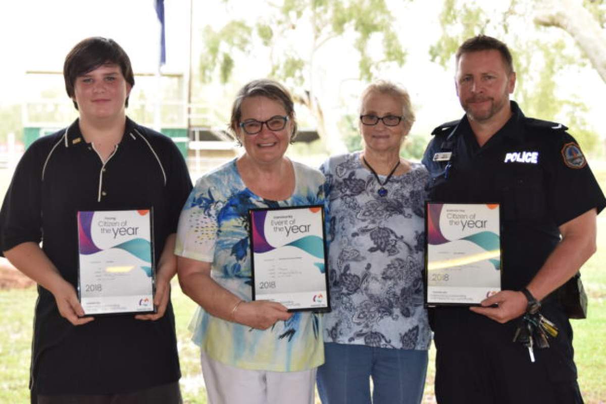 Four award recipients with Citizen of the Year certificates