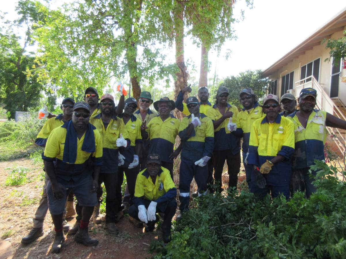 CDP participants standing in a group in front of trees and grass