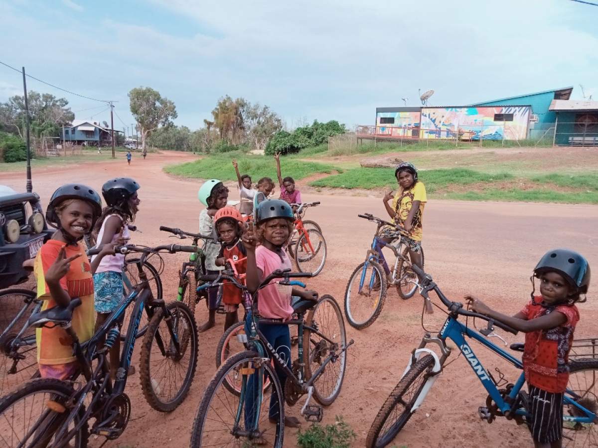 Kids riding bikes in a remote community